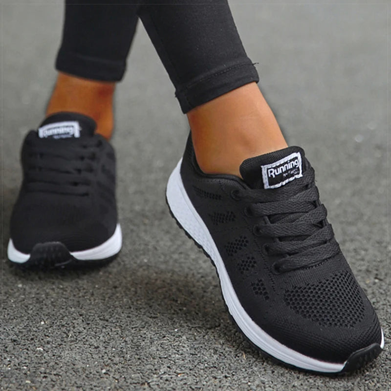 Women's black orthopedic lightweight walking shoes with white sole
