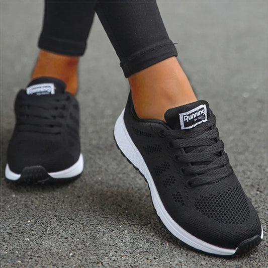 Women's black orthopedic lightweight walking shoes with white sole