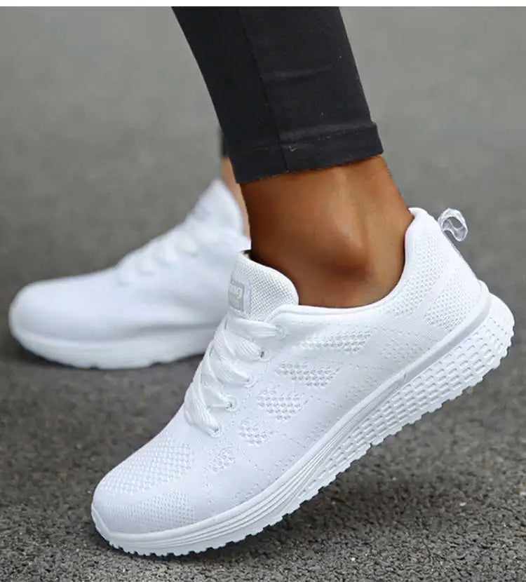 Women's white orthopedic lightweight walking shoes with white sole